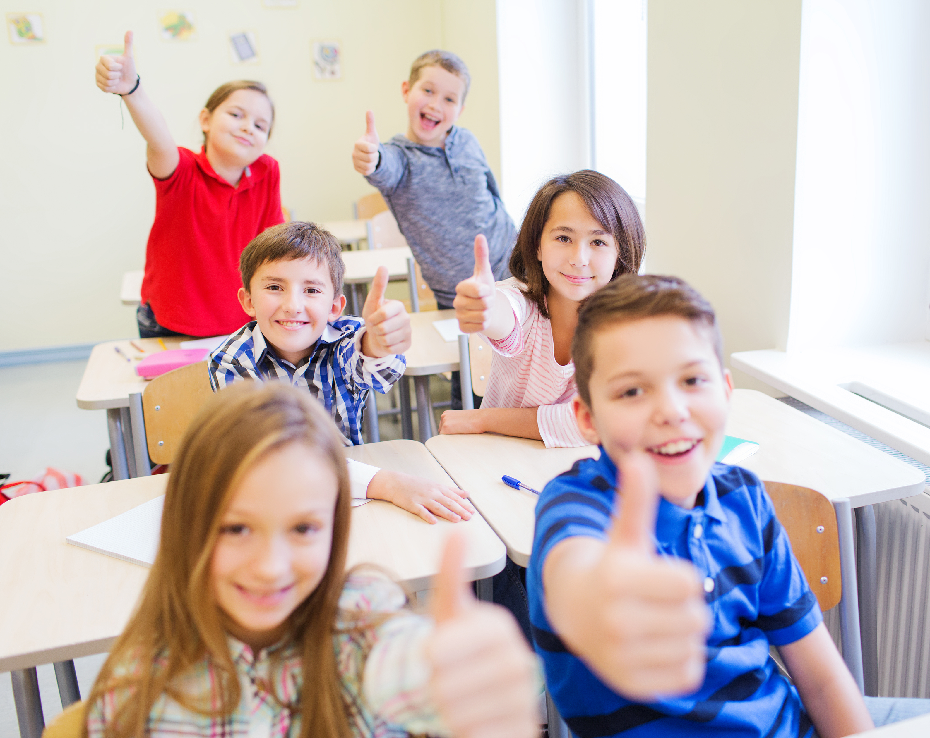 education-elementary-school-learning-gesture-people-concept-group-school-kids-sitting-classroom-showing-thumbs-up